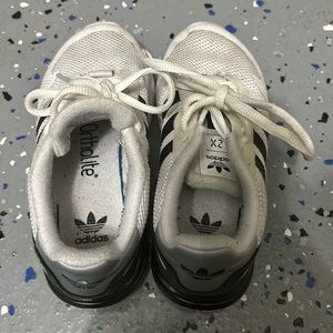 White and black adidas boy shoes-Ortholite